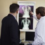 doctor-pointing-x-ray-result-beside-man-wearing-black-suit-2182972-min-150x150
